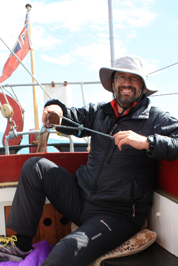 Mike Wade on Tramontana's helm